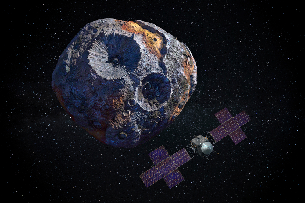 写真・図版 : 探査機が小惑星「16プシケ」の軌道上を周回する想像図＝Shutterstock.com