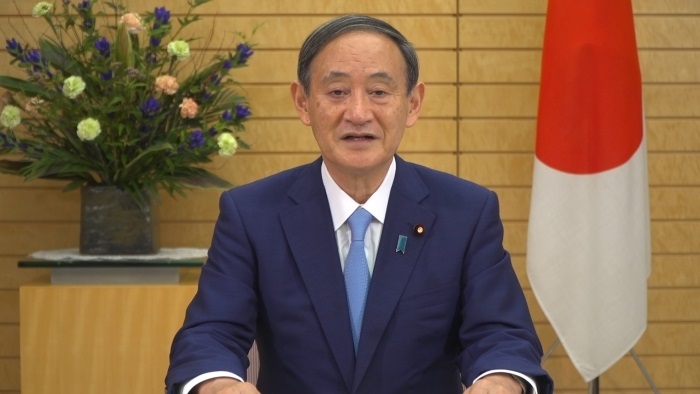 写真・図版 : 事前録画した映像を通じて、国連総会での一般討論演説を行う菅義偉首相＝外務省提供 